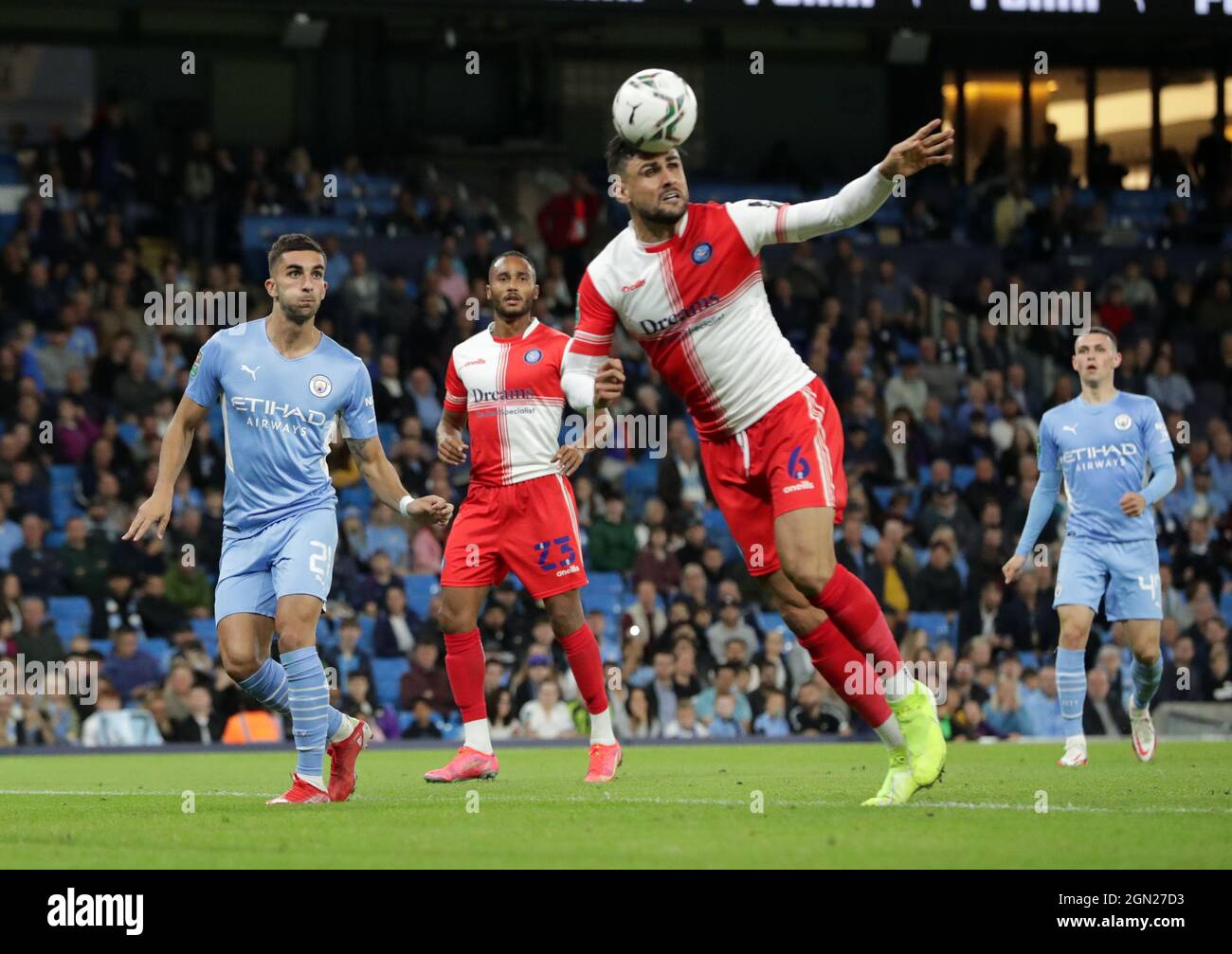 Etihad Stadium, Manchester, UK. 21st Sep, 2021. EFL Cup Football Manchester City versus Wycombe Wanderers; Ryan Tafazolli of Wycombe Wanderers heads a clearance Credit: Action Plus Sports/Alamy Live News Stock Photo