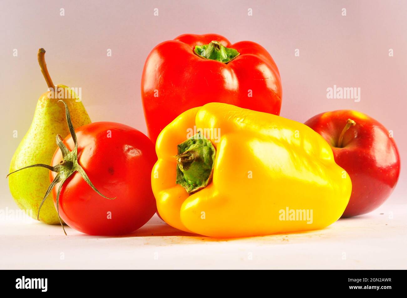 Red pepper, pear and apple on the table Stock Photo
