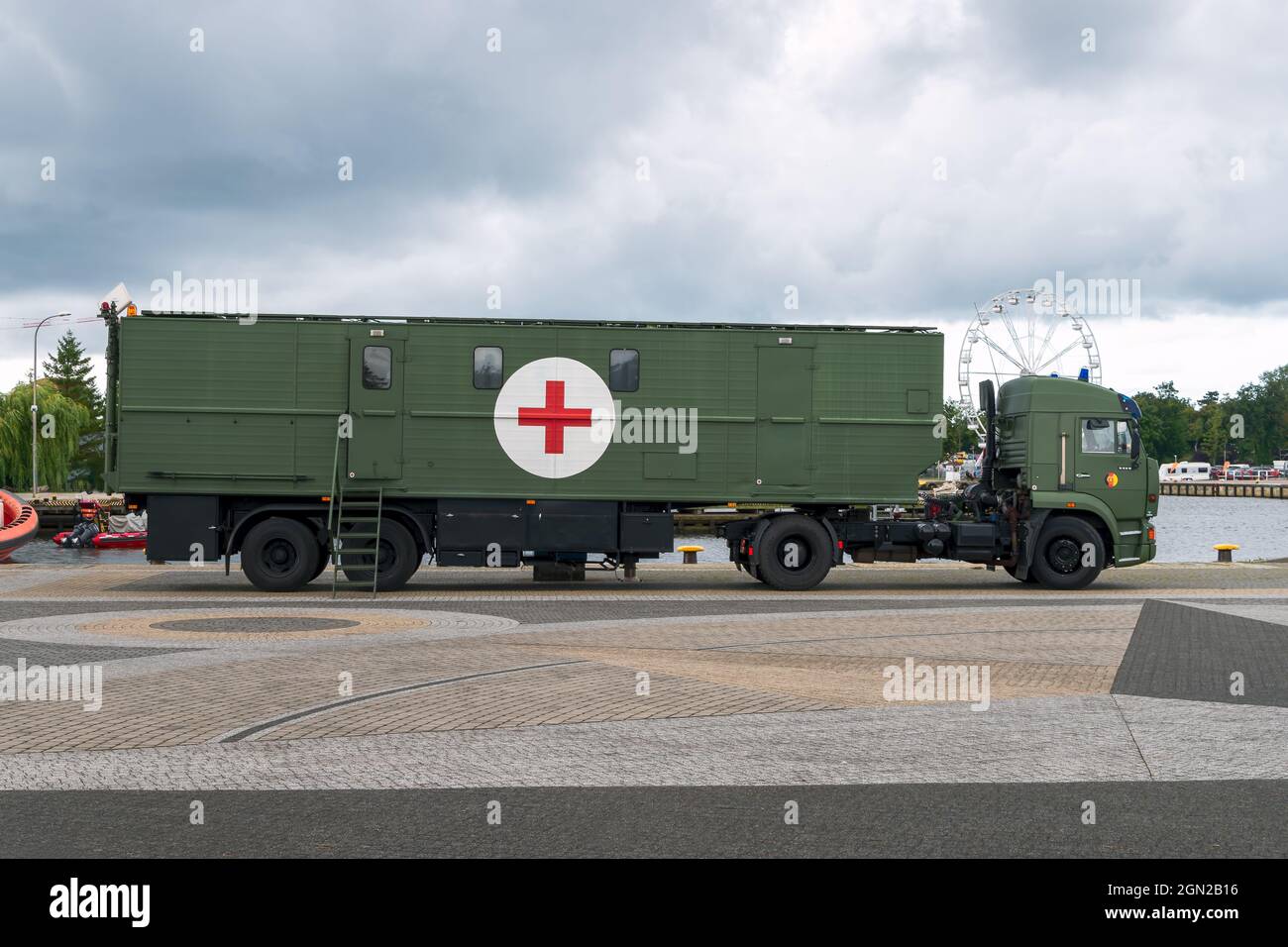 a medical military truck parked in the port of Darłowo Stock Photo