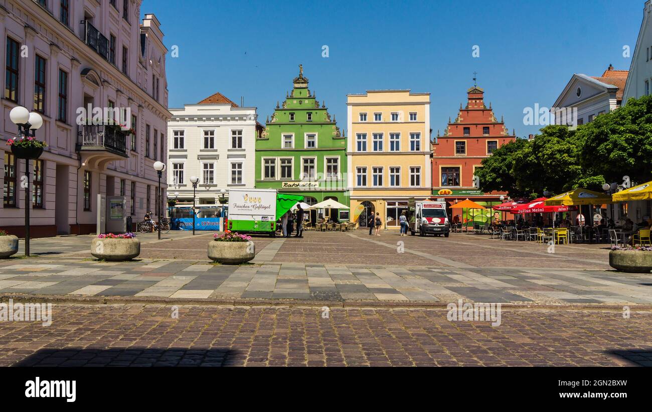 GUESTROW, MECKLENBURG-WESTERN POMERANIA, GERMANY - market place of Guestrow with town hall, restaurant and other historic buildings Stock Photo