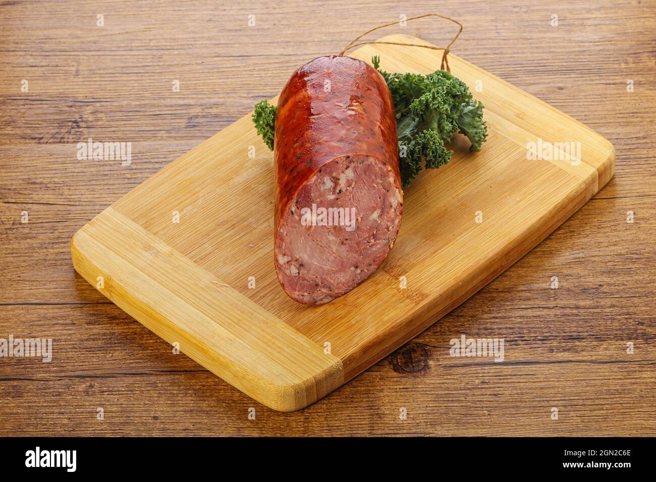 Pork ham sausage appetizer over board Stock Photo Alamy