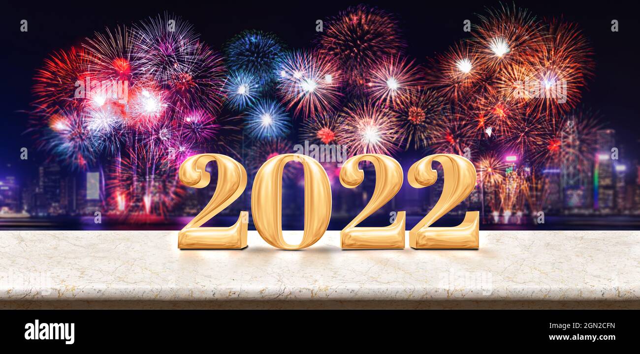 Happy new year 2022 (3d rendering) fireworks over cityscape at night with empty white marble table,Banner mock up template for display or montage of p Stock Photo