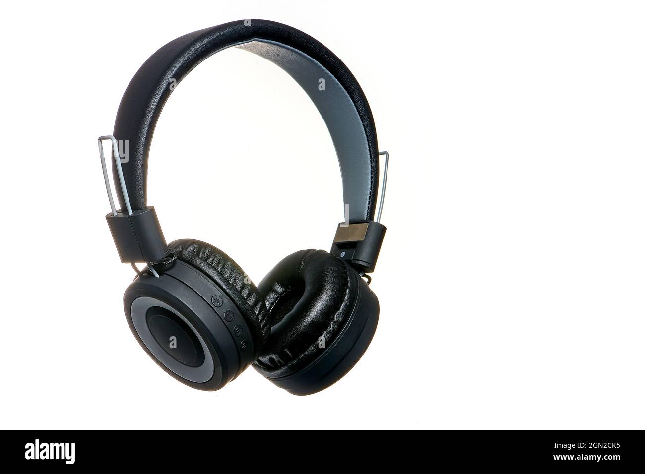 Black wireless headphones on an isolated background, copy space Stock Photo