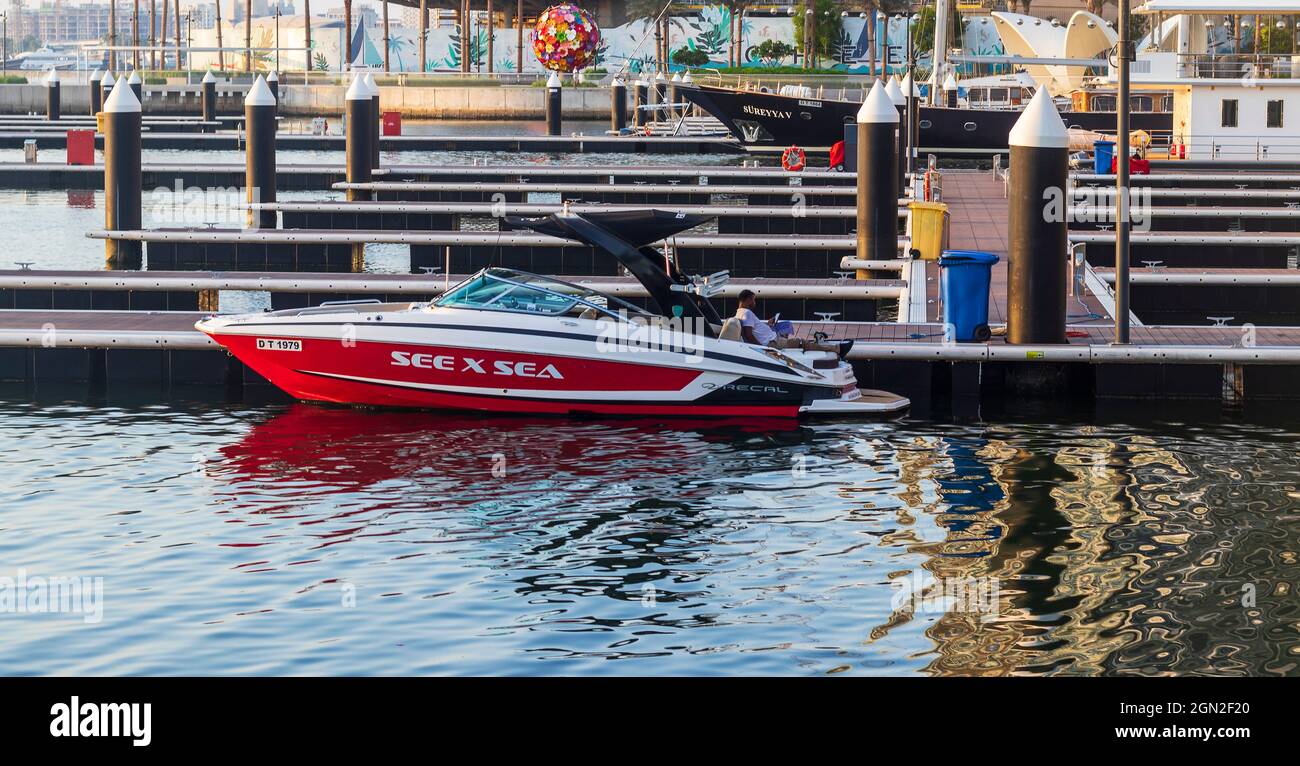 Man sitting on boat dubai hi-res stock photography and images - Alamy
