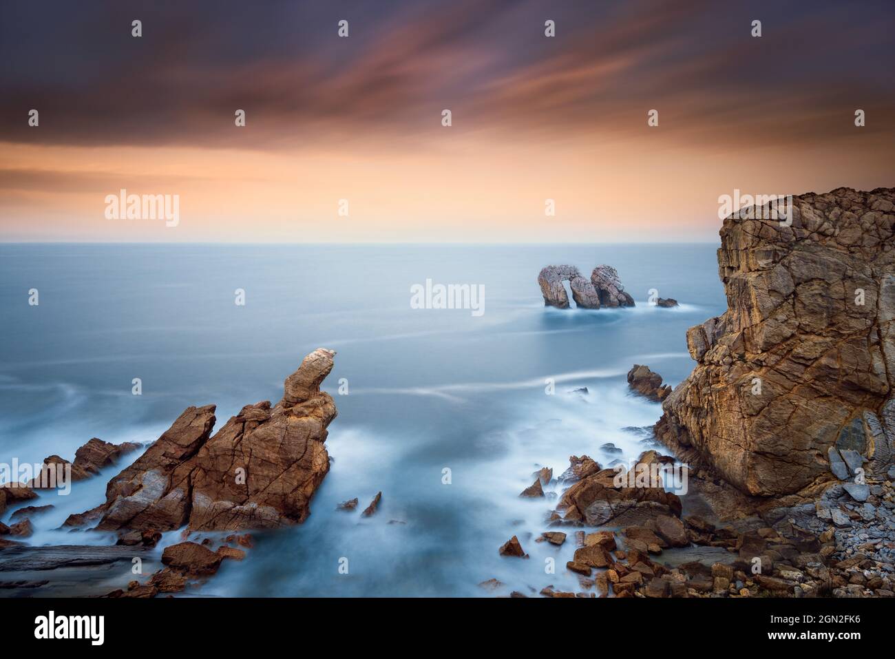 SPAIN, CANTABRIA. LOS URROS ROCKS AT SUNSET Stock Photo