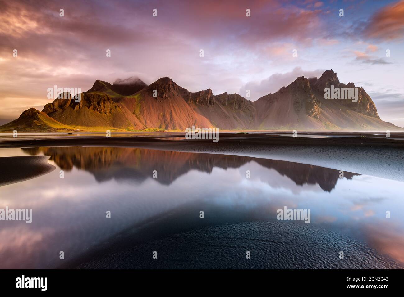 ICELAND VESTRAHORN VESTRAHORN MOUNTAIN AT SUNRISE WITH ITS REFLECTION 
