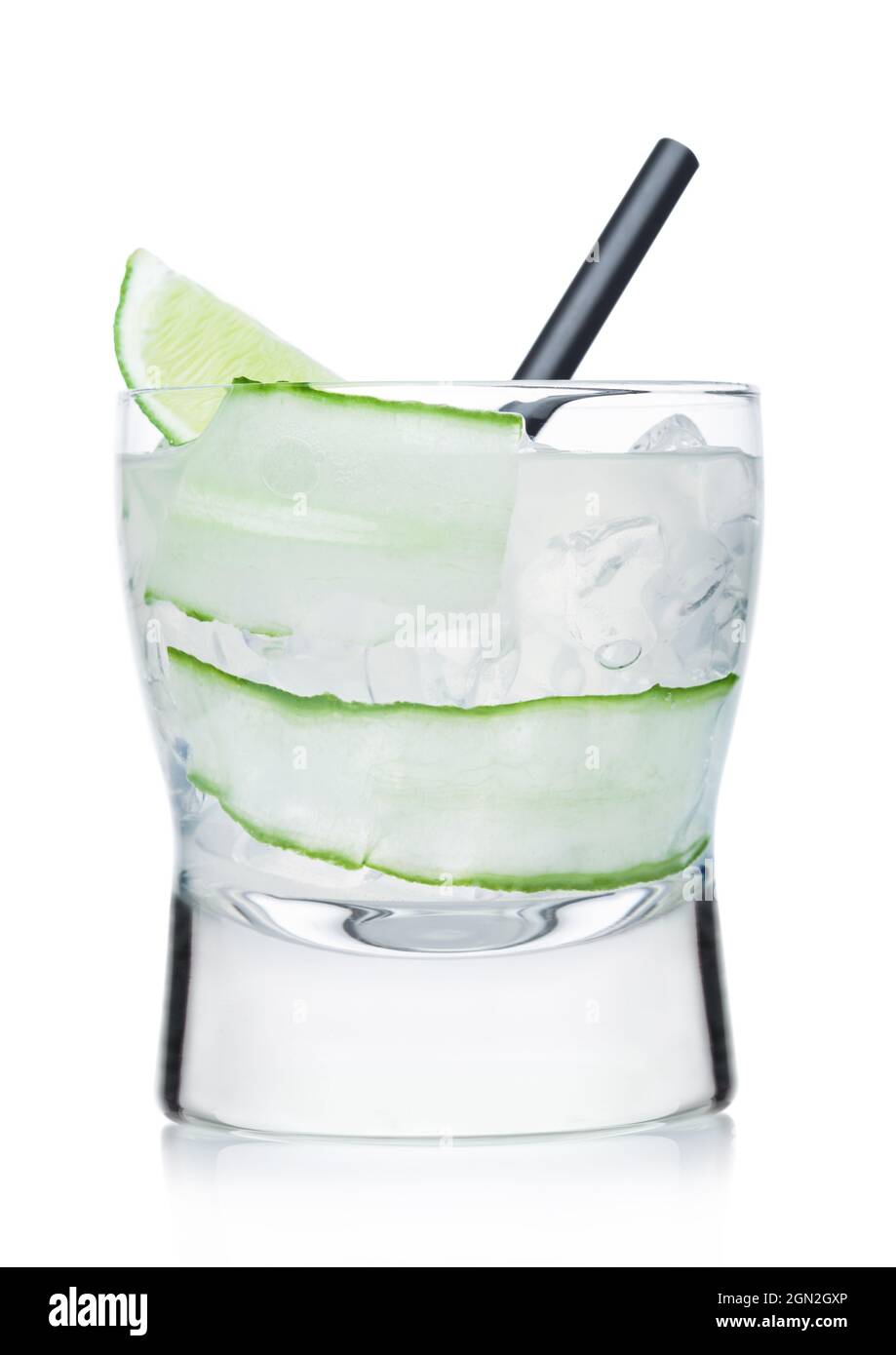 Gimlet cocktail in modern glass with ice cubes and straw, cucumber and