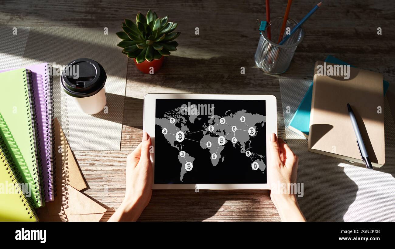 Bitcoin world map and blockchain technology concept on screen Stock Photo