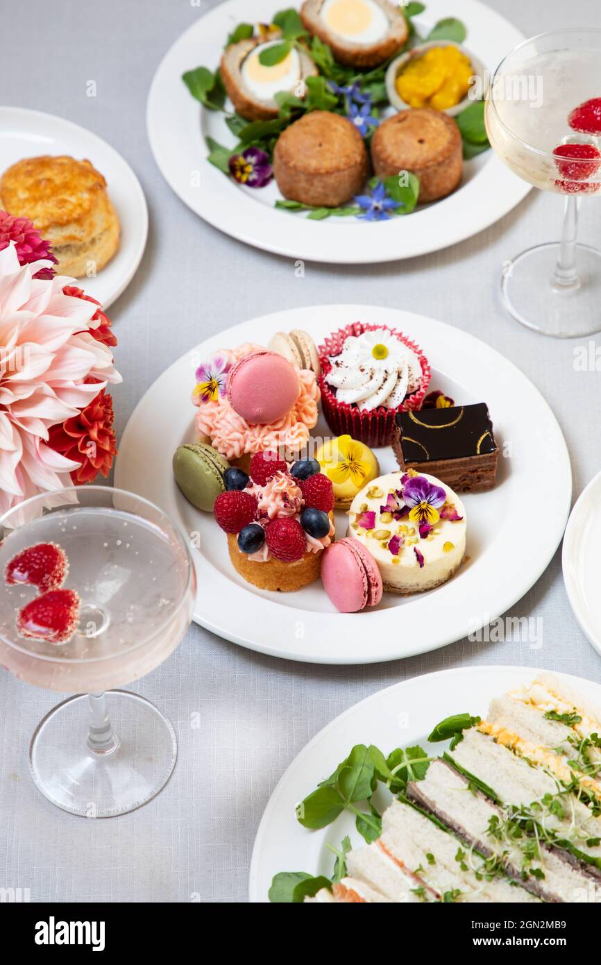 English afternoon tea with cakes and sandwiches Stock Photo