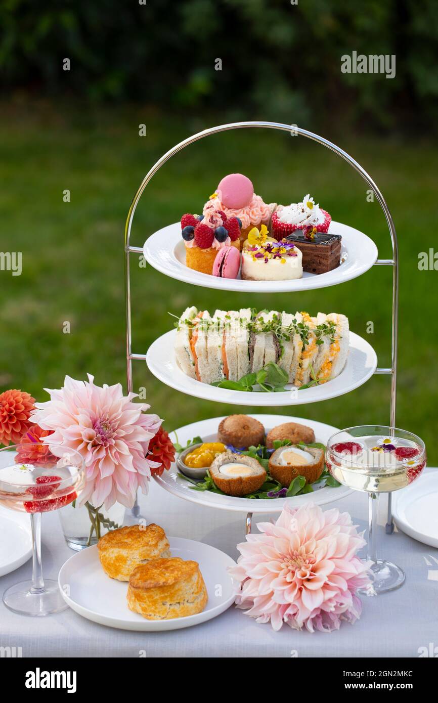 English afternoon tea with cakes and sandwiches Stock Photo