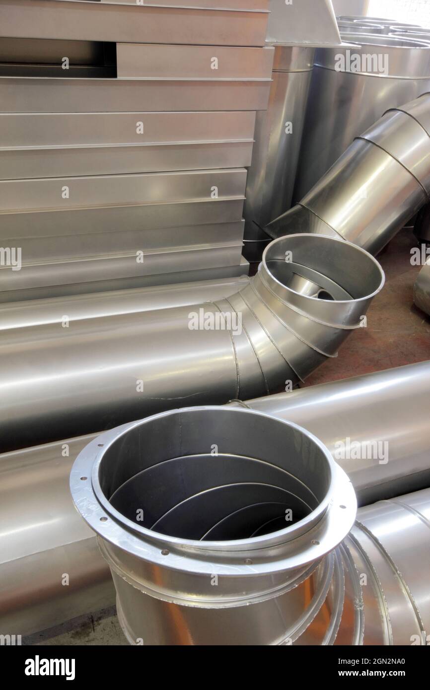 Round and angular galvanized pipes Stock Photo