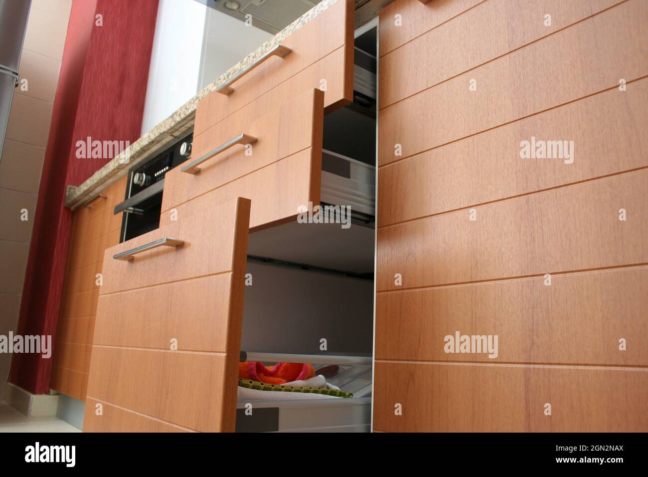 Modern and wooden kitchen drawers. Sliding kitchen drawers Stock Photo