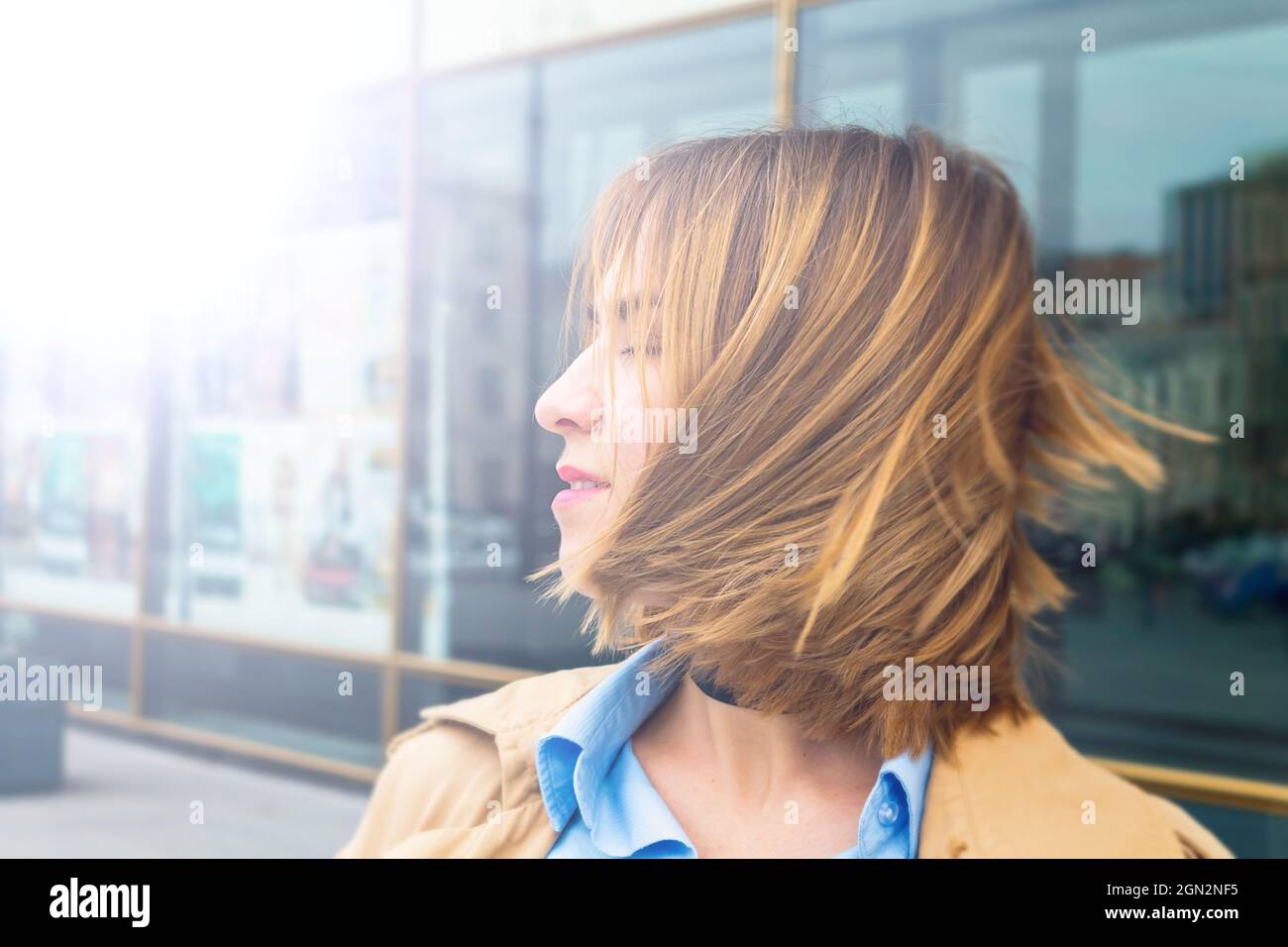 Woman with closed eyes smiling new day. Stock Photo