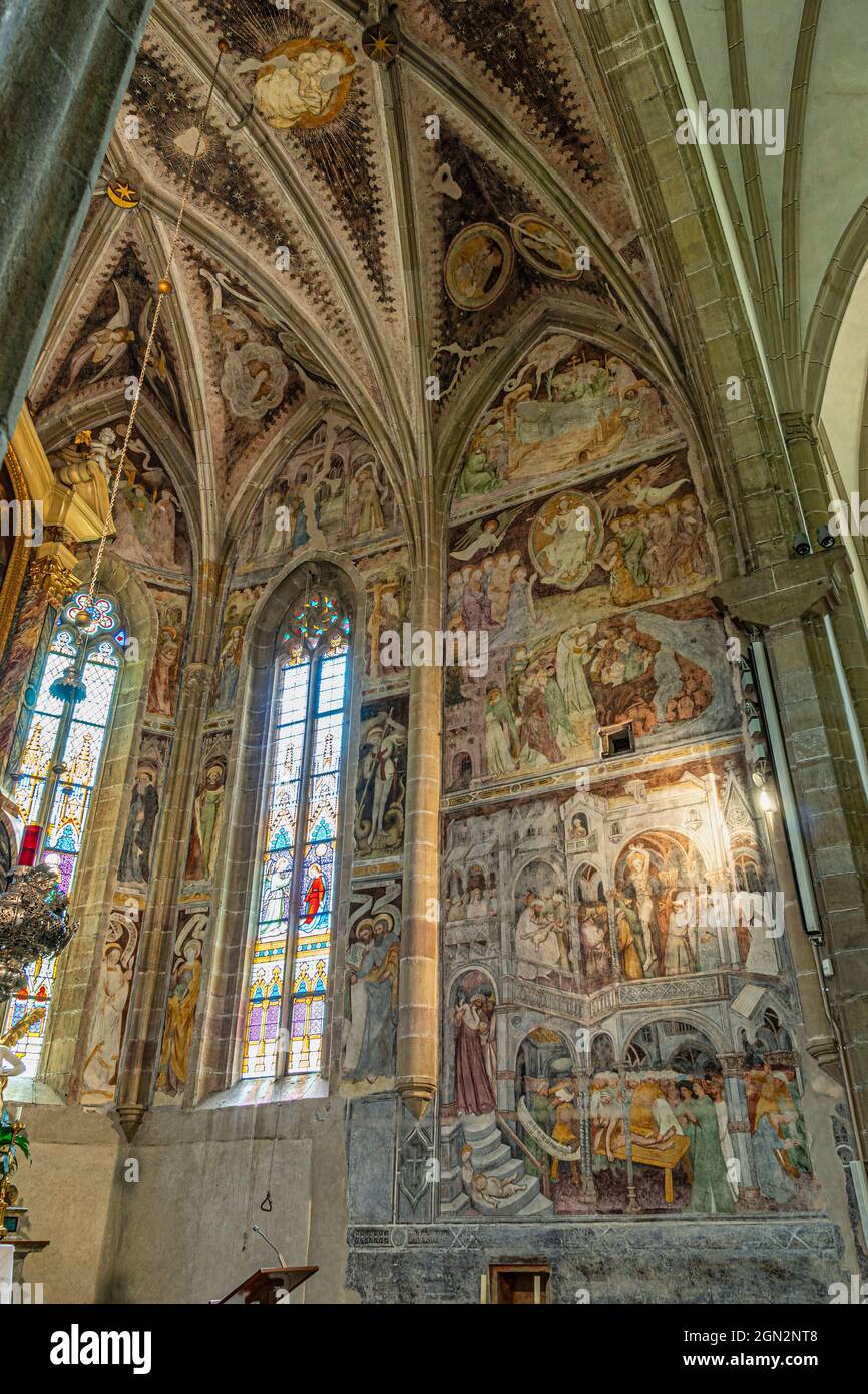 The church of Santi Quirico and Giulitta. Cycle of frescoes in the neo-Gothic choir of the early 15th century. Termeno, Trentino Alto Adige Stock Photo