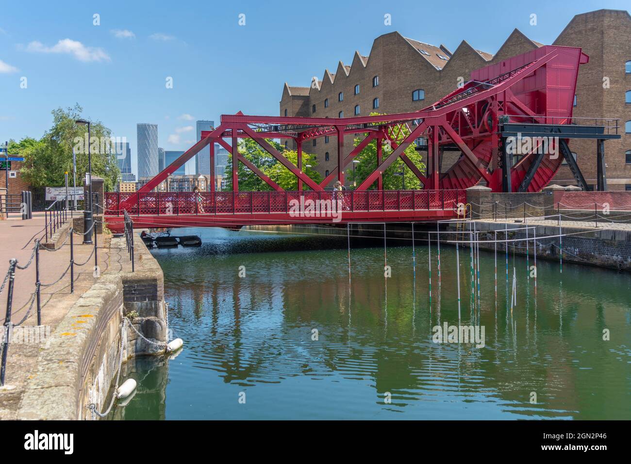 View of Canary Wharf Financial District and Bascule Bridge at the Shadwell Basin, Wapping, London, England, United Kingdom, Europe Stock Photo