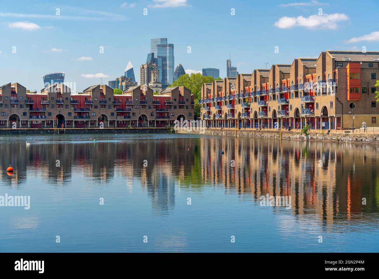 View of City skyline reflecting in the Shadwell Basin, Wapping, London ...