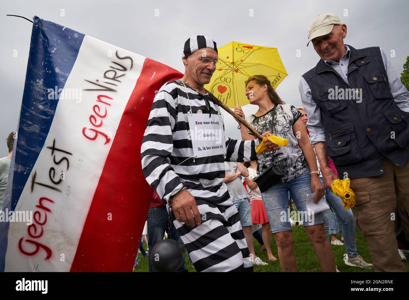 Man in prisoner costume attends anti-vaccine rally Stock Photo