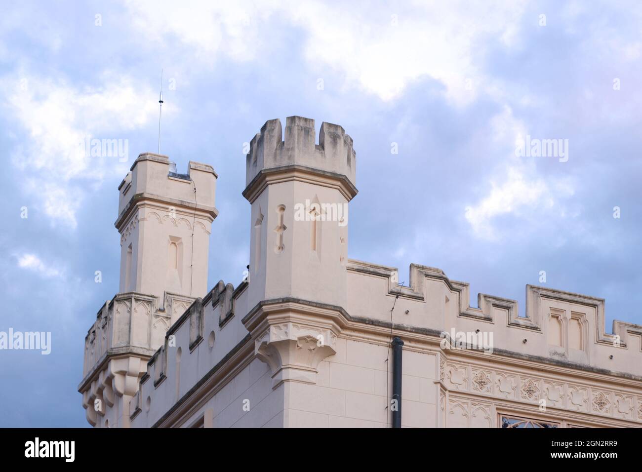 The towers of Lednice castle with sky and clouds. The castle was inscribed on the UNESCO list in 1996. Stock Photo
