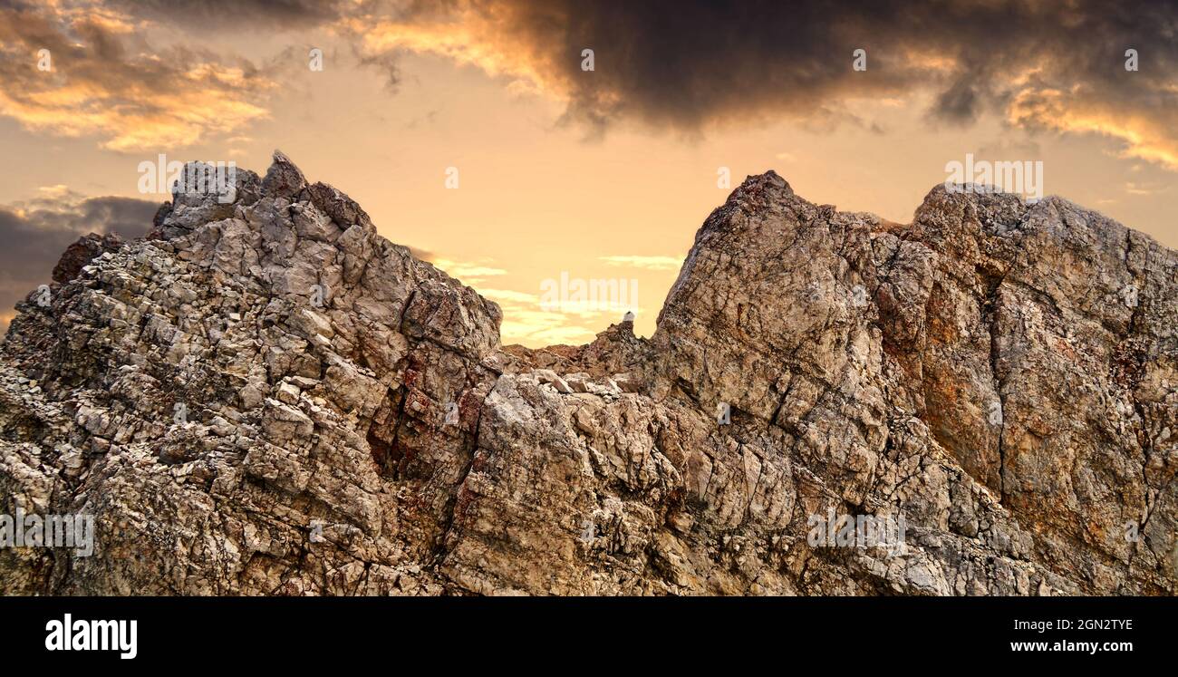 summit of Zugspitze in the german alps with dark evenibg clouds Stock Photo