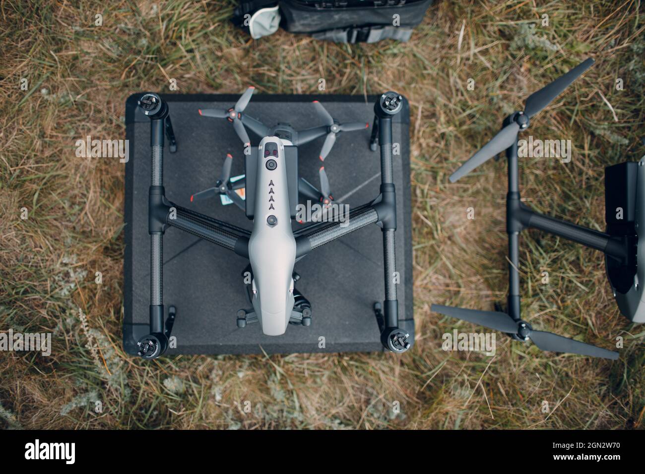 Big quadcopter drone before aerial flight and filming top view. Stock Photo