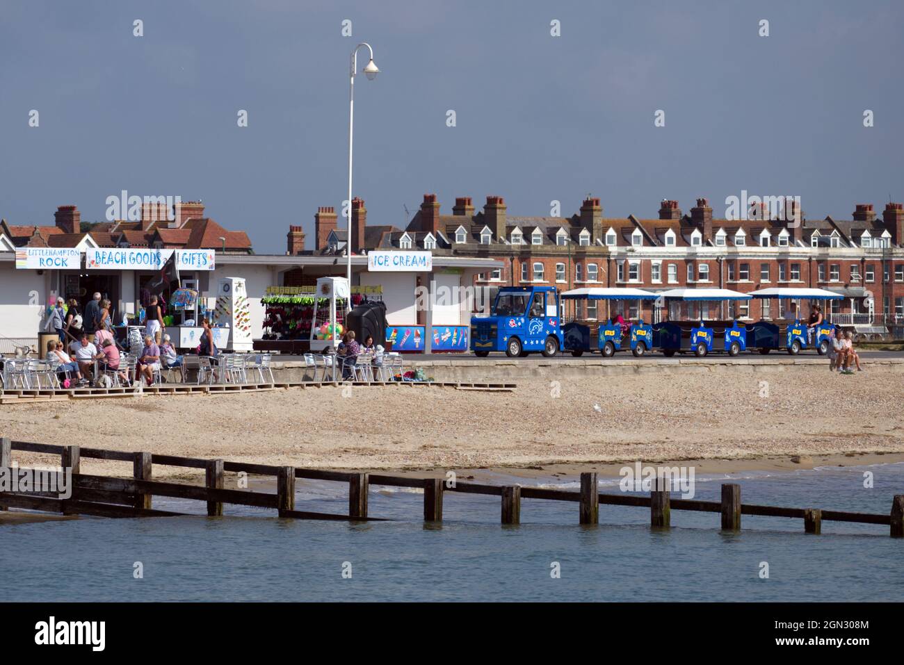 Littlehampton Seafront and beach with people sitting outside a cafe