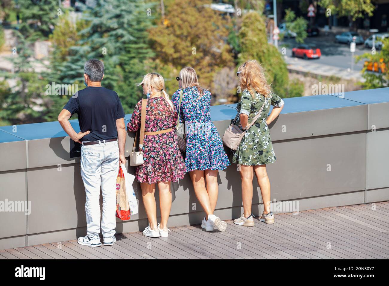 ANKARA-TURKEY, September 20, 2021: Tourist family watching the view of Ankarafrom Atakule in Cankaya district. Capital city of Turkey is popular for t Stock Photo