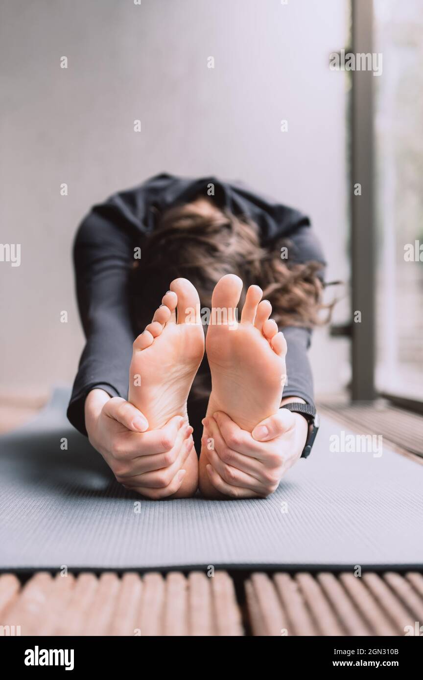 Young woman doing yoga Stock Photo