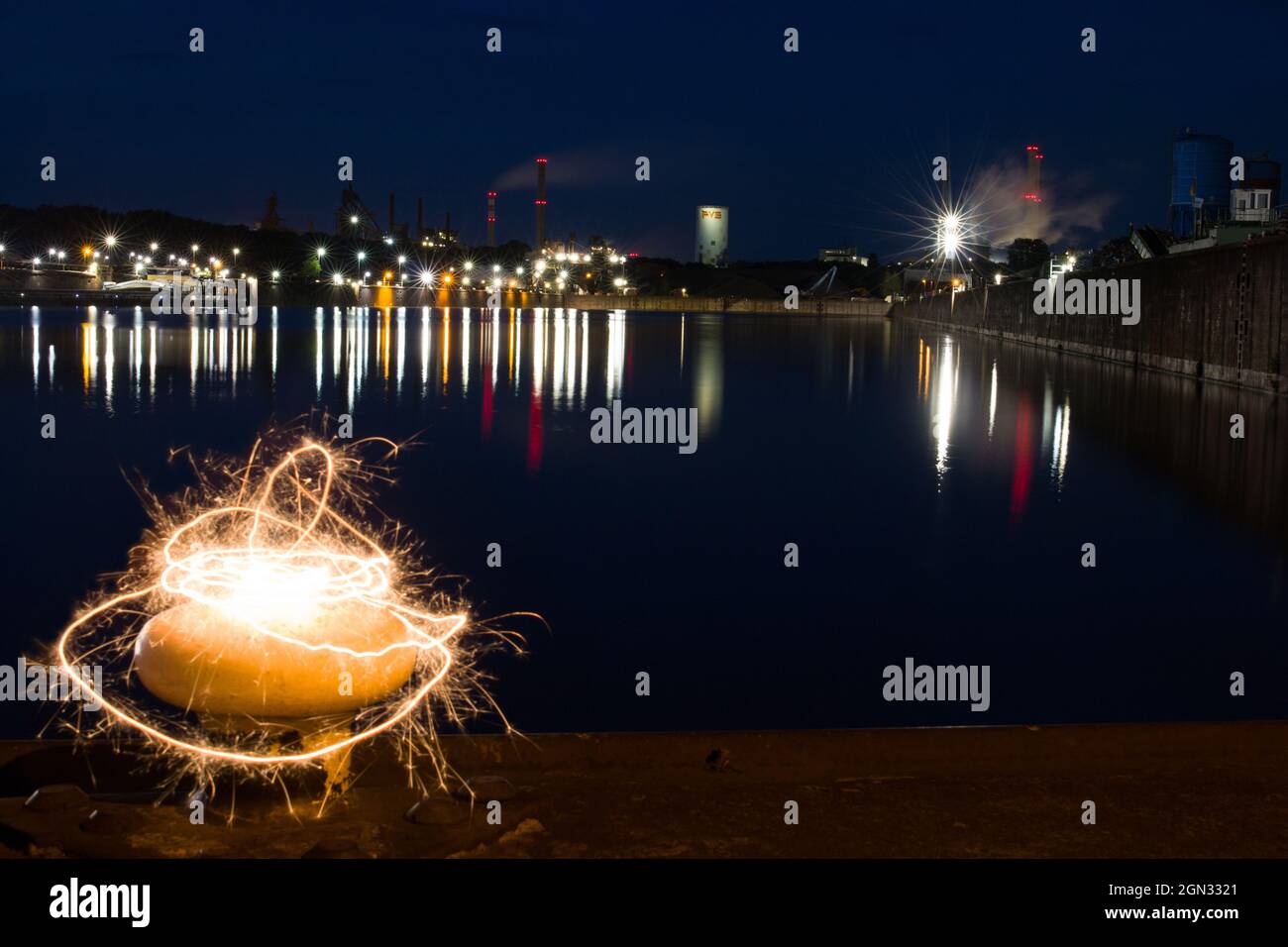 Light painting with sparklers at an industrial port Stock Photo