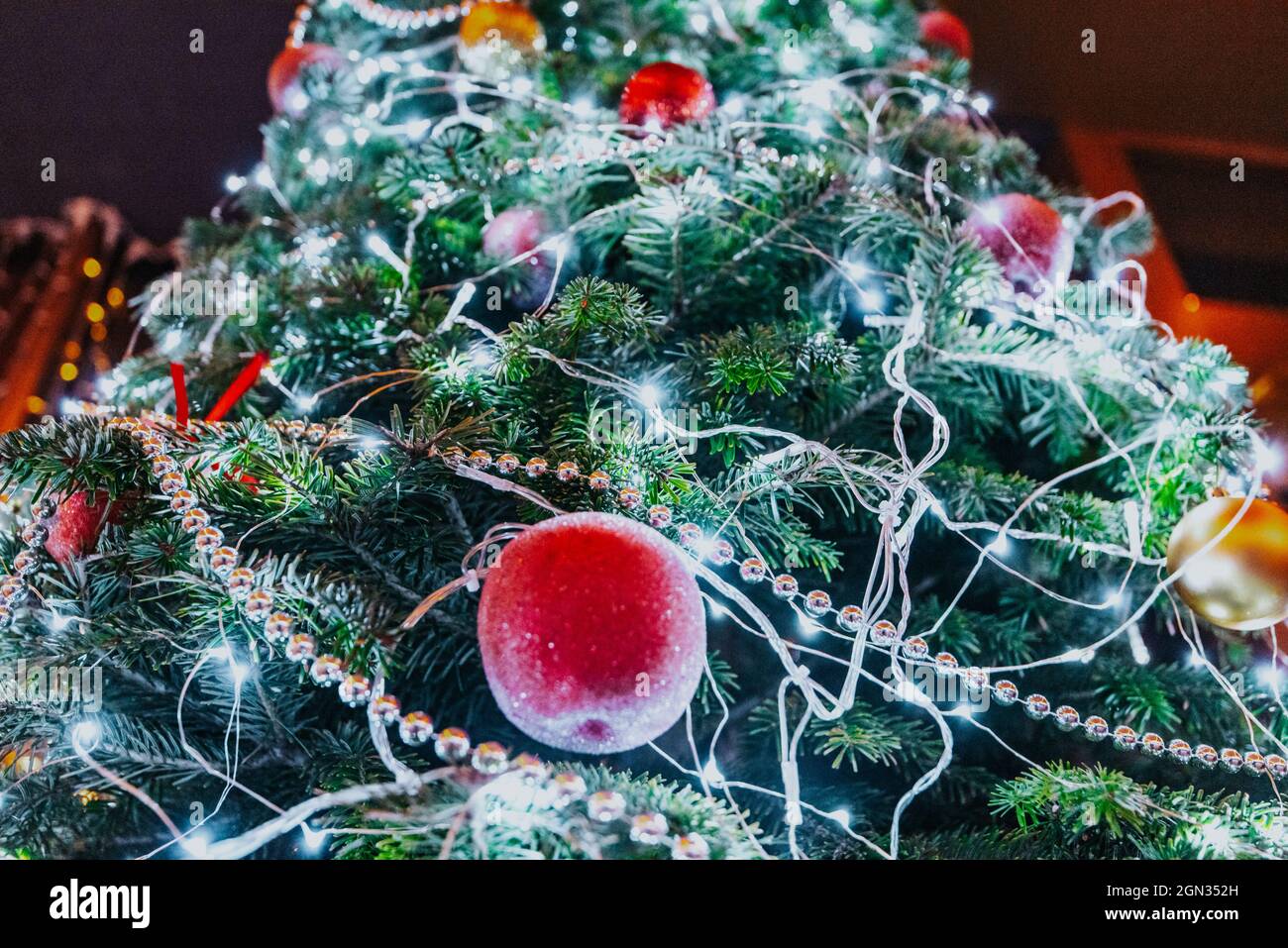 Christmas tree on the street. decorated with balloons and a glowing ...