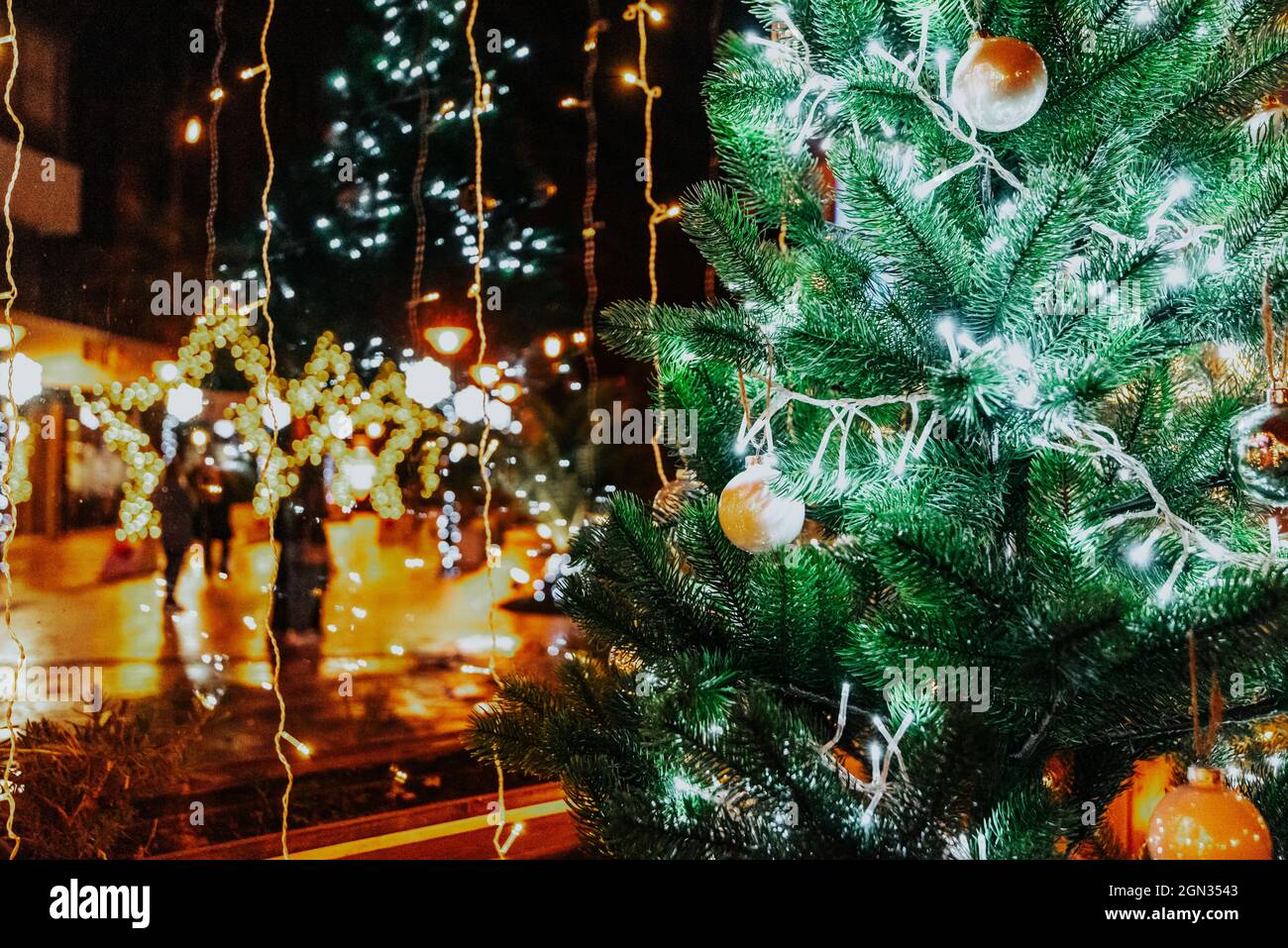 Christmas tree view from the cafe to the street. decorated with ...