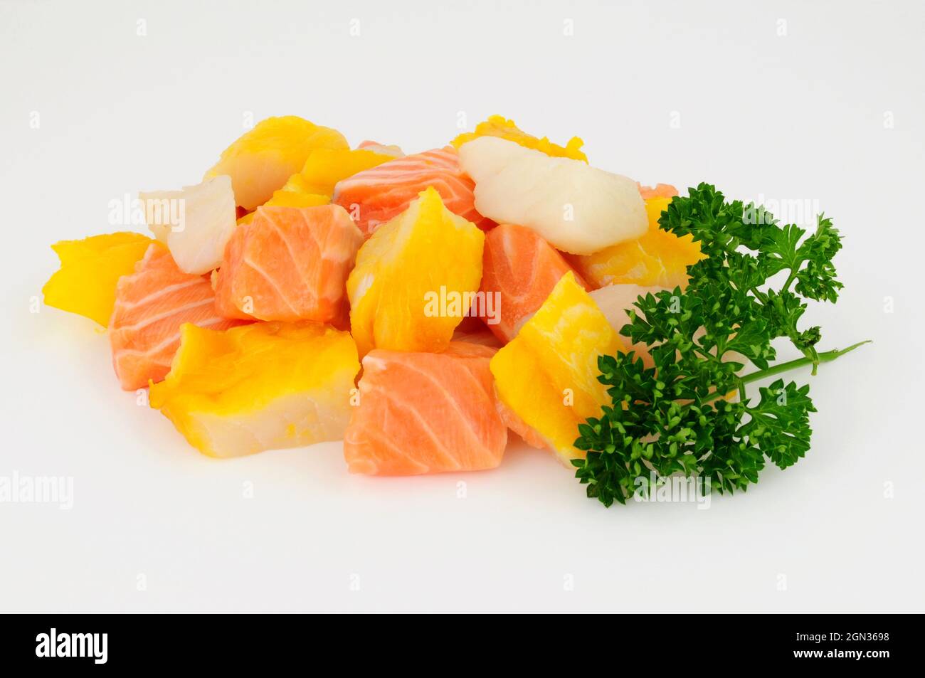 Mixed group of fresh raw salmon, cod and smoked haddock chunks prepared