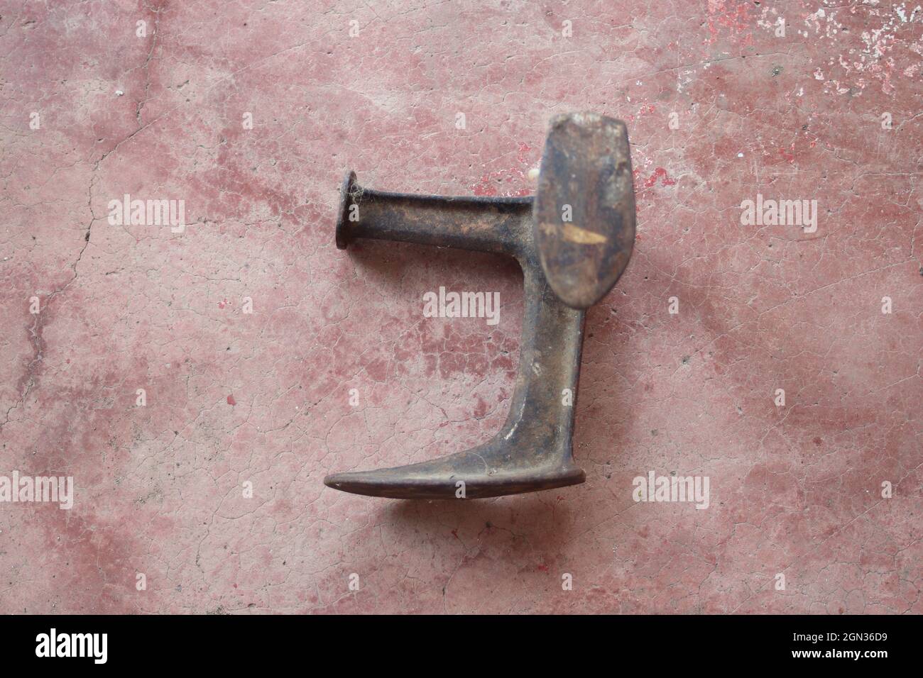 Old weathered metal tool for shoemakers Stock Photo