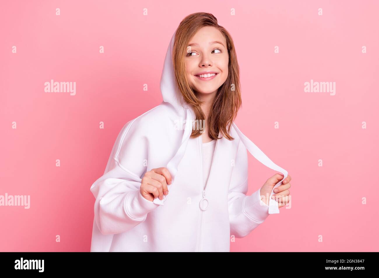 Photo of shiny charming school girl wear white hoodie smiling looking