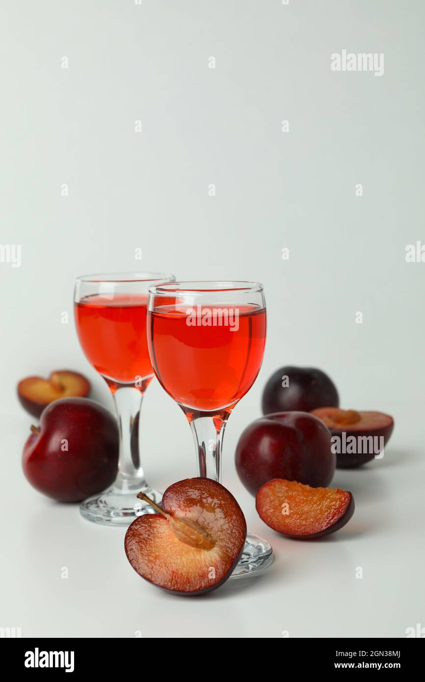 Plum brandy shots and ingredients on white background Stock Photo Alamy