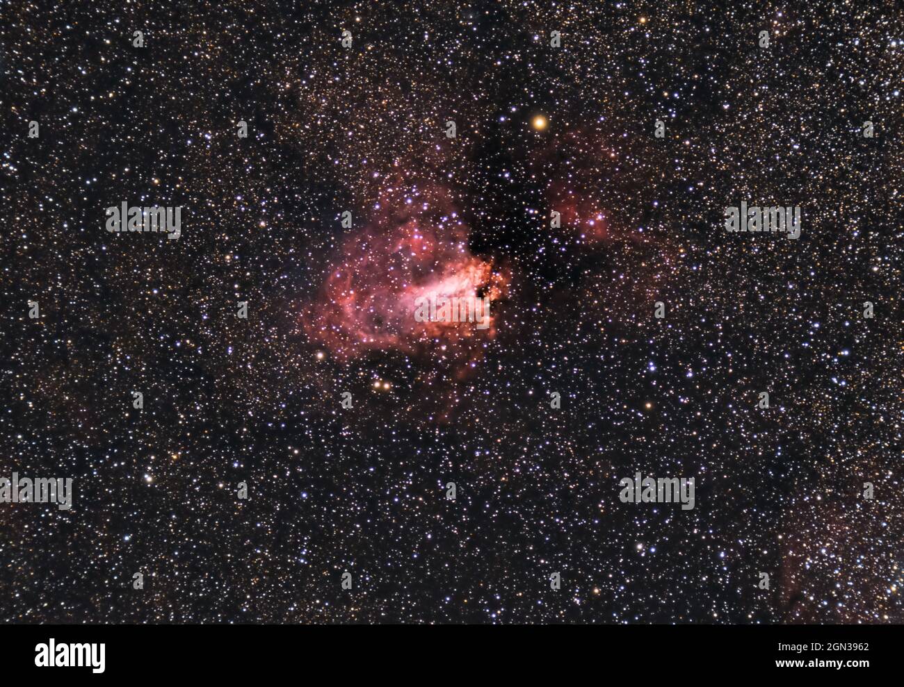 The Omega Nebula, also known as the Swan Nebula, Checkmark Nebula, and Horseshoe Nebula Messier 17, M17, captured with a refracting telescope Stock Photo