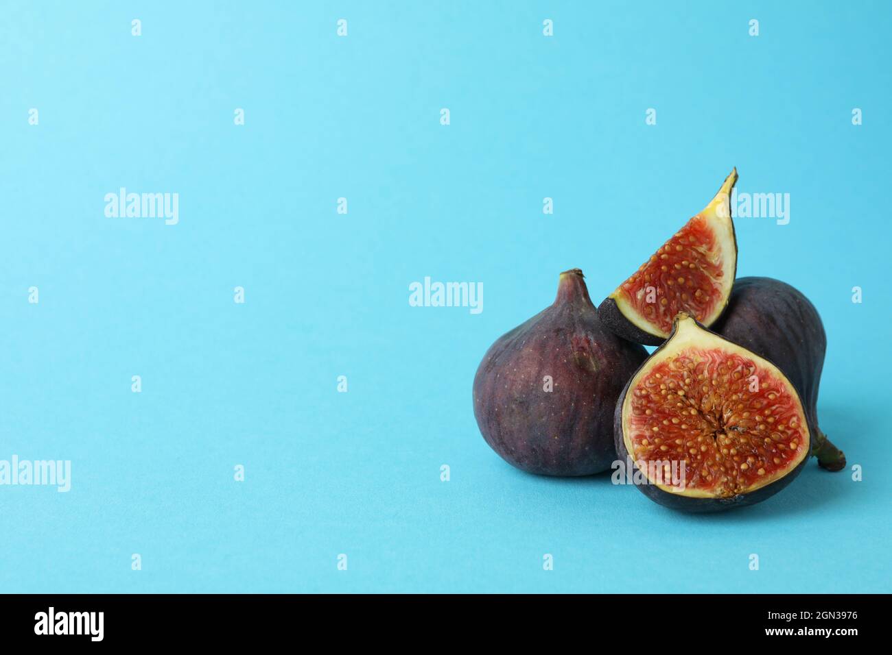Fig on blue background, space for text Stock Photo