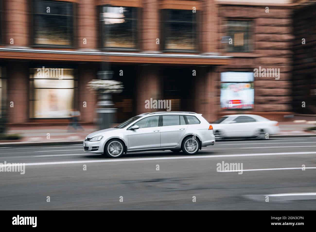 Ukraine, Kyiv - 2 June 2021: Silver Volkswagen Golf car moving on the street. Editorial Stock Photo