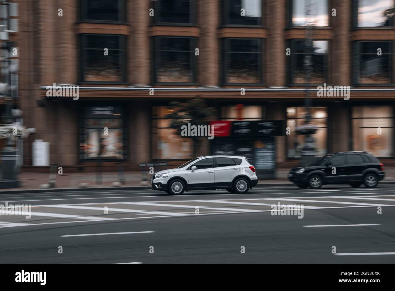 Ukraine, Kyiv - 2 June 2021: White Suzuki SX4 car moving on the street. Editorial Stock Photo
