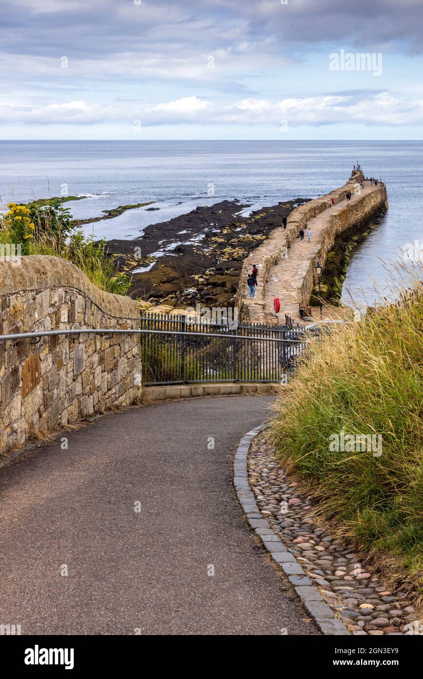 Path leading down to the picturesque harbour of St Andrews in Fife on the east coast of Scotland. Stock Photo