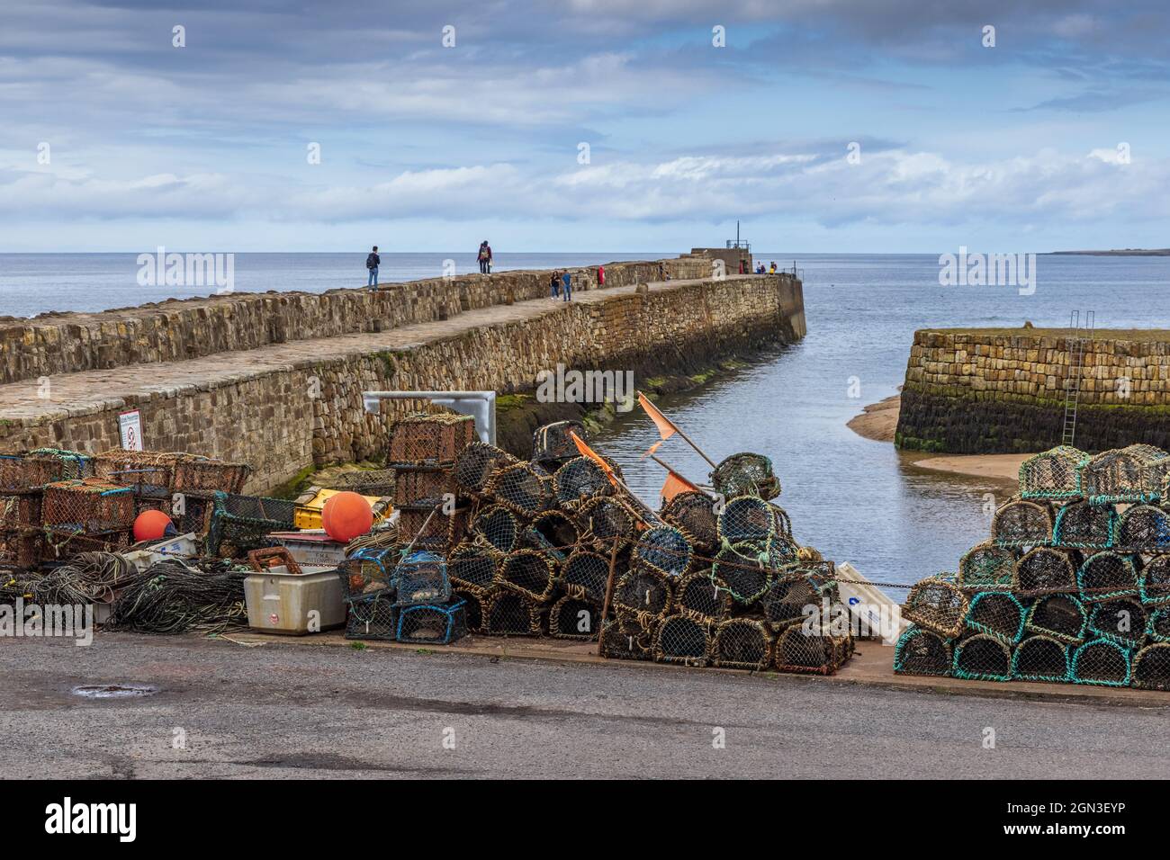 Lobster pots by the harbourside at St Andrews harbour in Fife, Scotland. Stock Photo