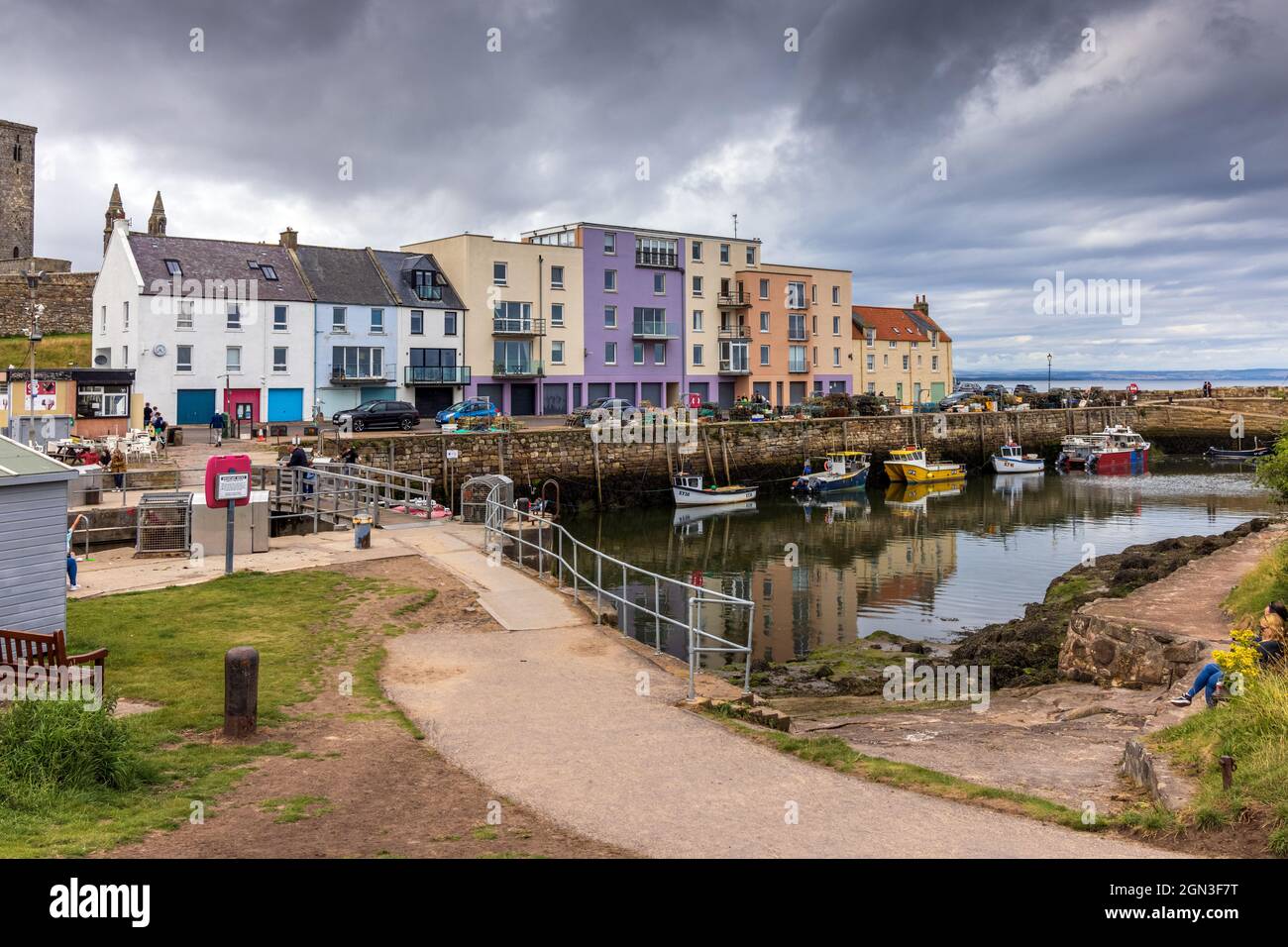 Moored fishing boats at the picturesque harbour of St Andrews in Fife on the east coast of Scotland. Stock Photo
