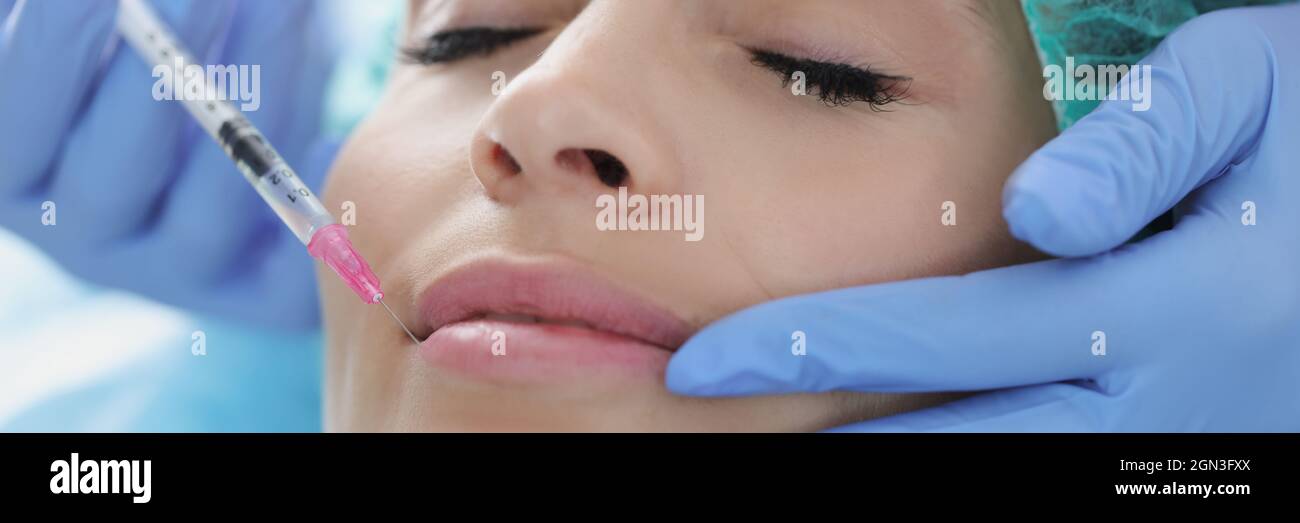 Doctor giving facial injection hi-res stock photography and images - Alamy
