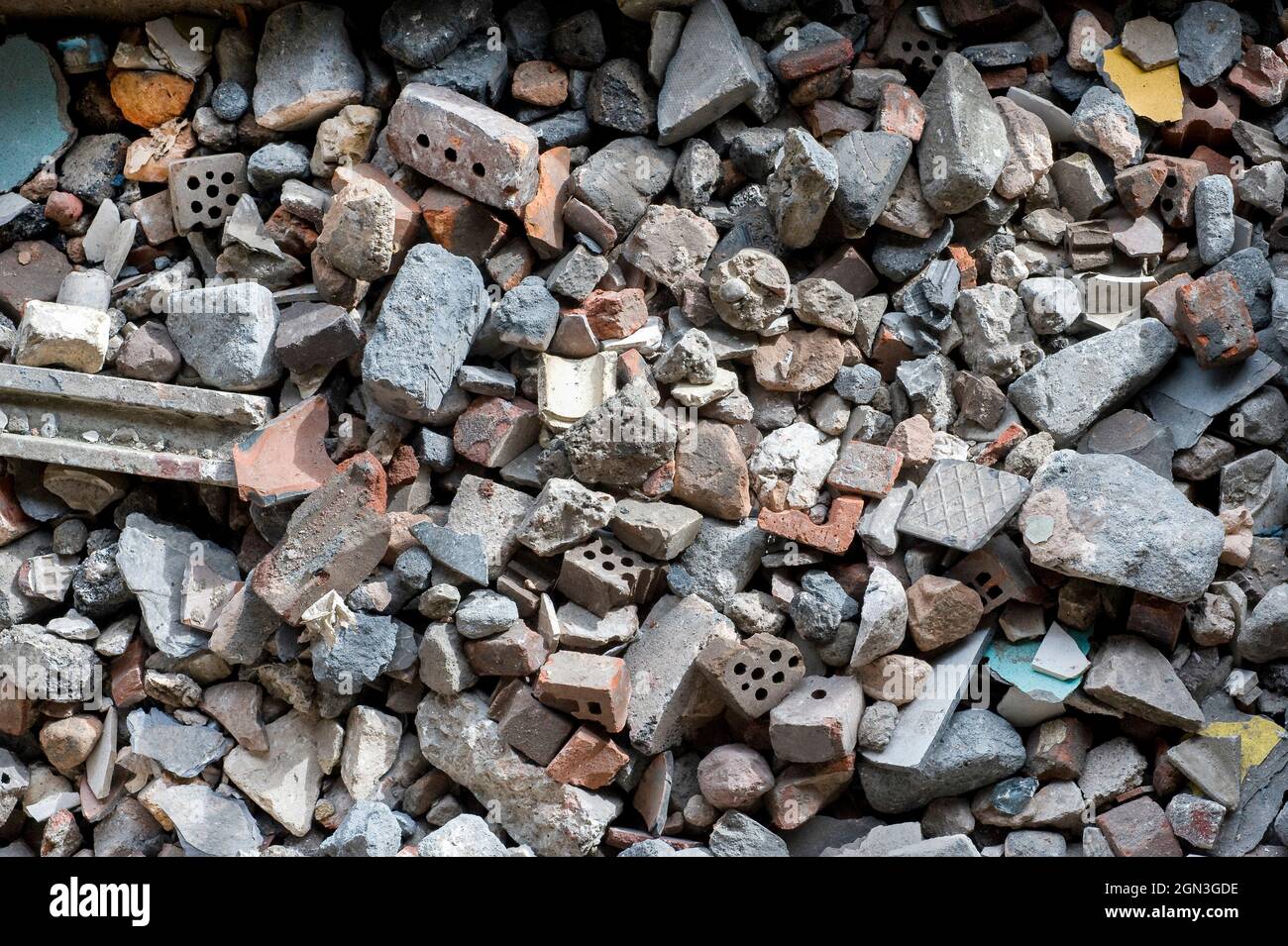 Piles of waste rubble at a materials recycling facility in England. Stock Photo