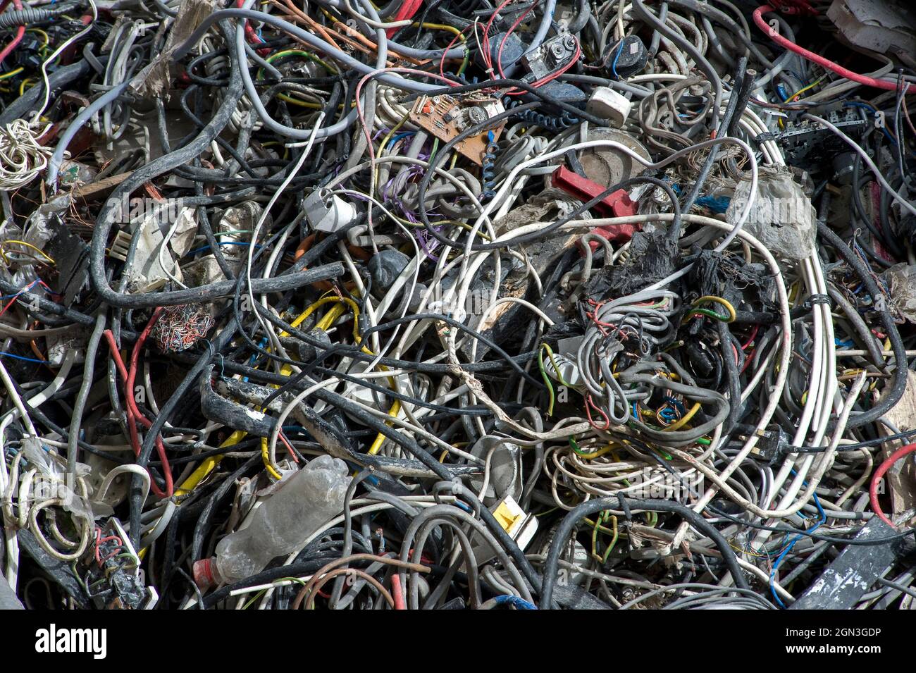 Piles of waste cable at a materials recycling facility in England. Stock Photo