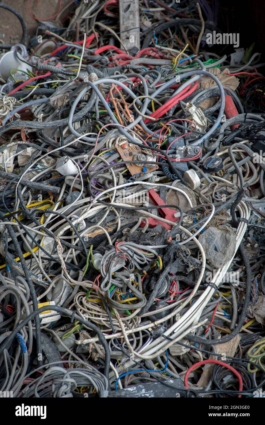 Piles of waste cable at a materials recycling facility in England Stock