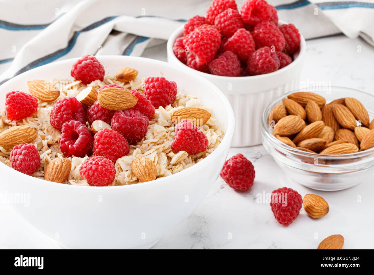 bowl of oatmeal with raspberries and almonds Stock Photo - Alamy