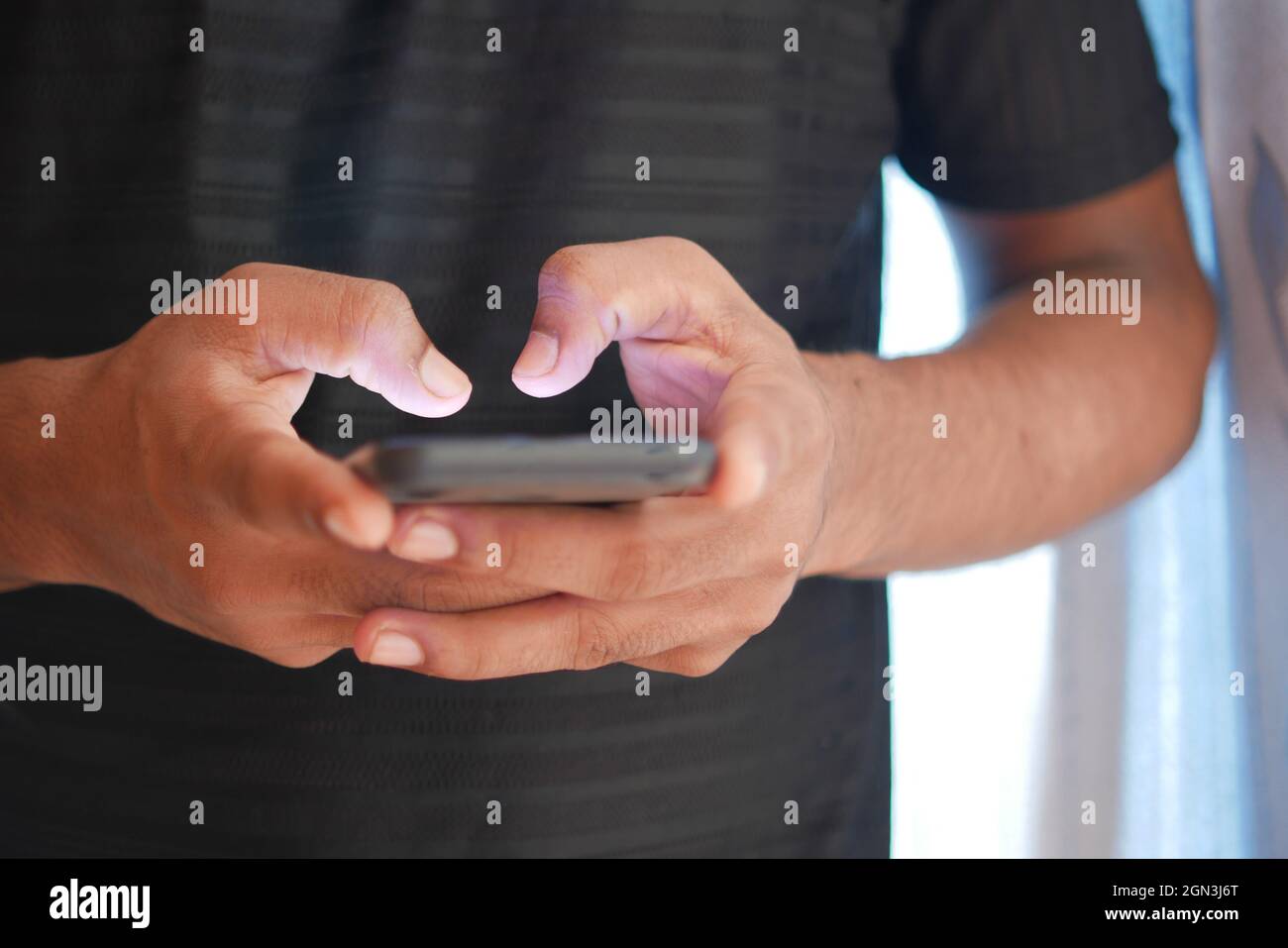 Close up of young man hand using smart phone Stock Photo - Alamy