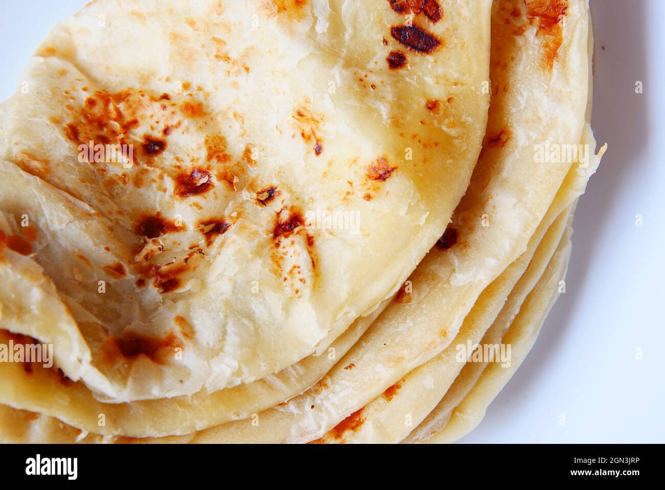homemade roti chapati on a white plate Stock Photo - Alamy