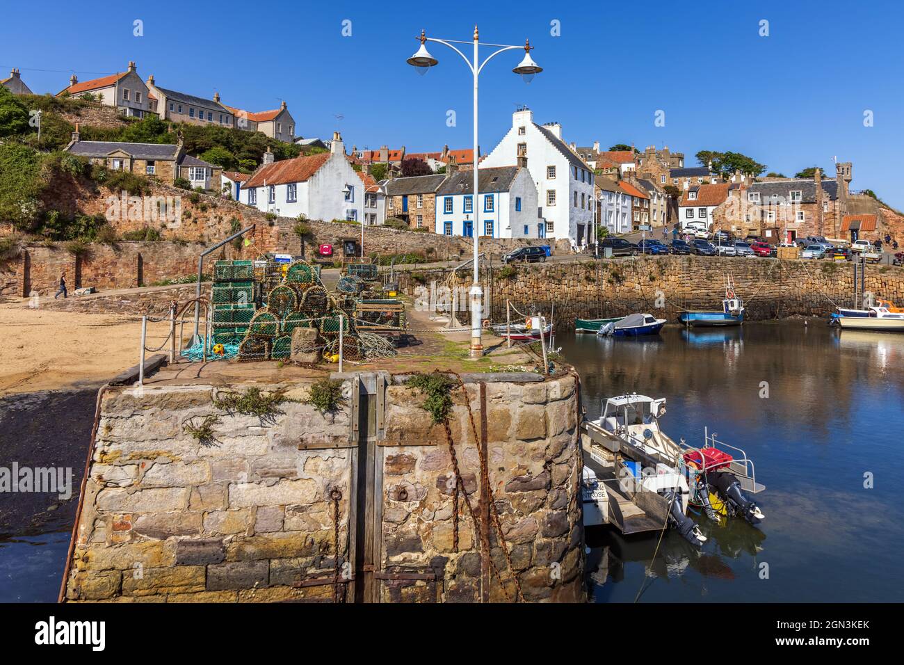 The historic fishing village of Crail, with its picturesque harbour and colourful fishing boats, on the east coast of Fife, Scotland. Stock Photo