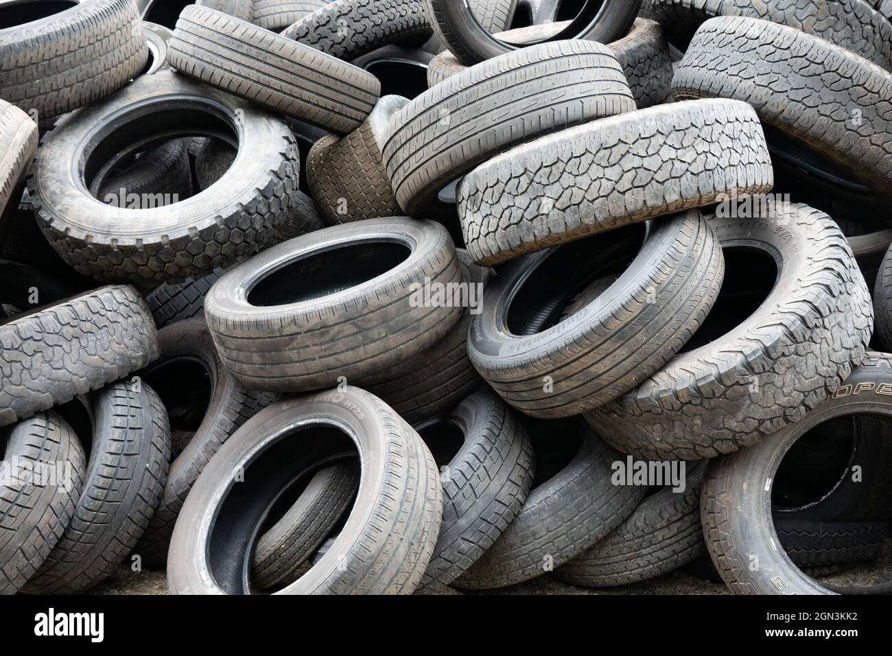 A pile of used worn tires ready for recycling Stock Photo